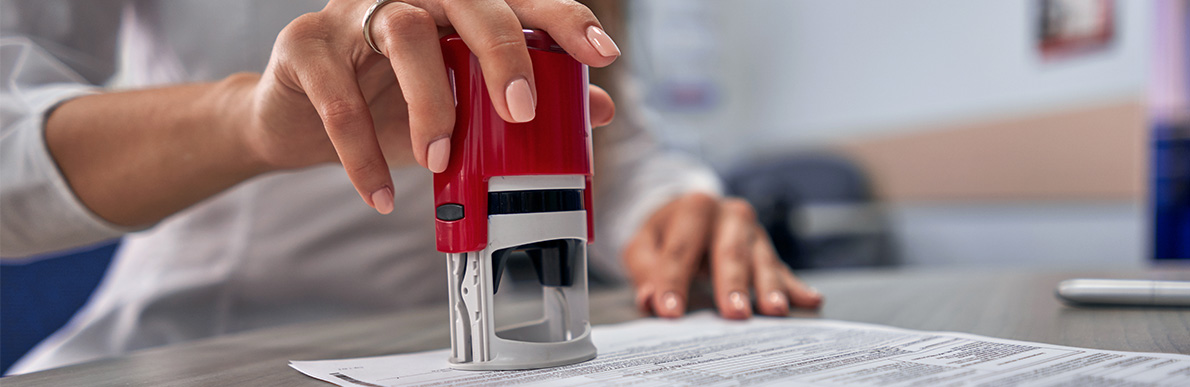Notary stamping a document