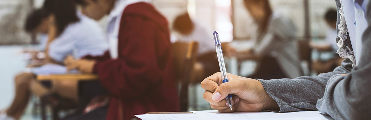 Students taking a test at desks